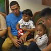 In this image taken from video, Javier Garrido Martinez, left and Alan Garcia, right, sit with their 4-year-sons at a news conference in New York, Wednesday, July 11, 2018. 