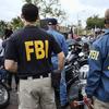 FBI agents look on as the gay pride parade kicks off in West Hollywood, Calif., on June 12, 2016.