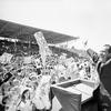 In this Sept. 19, 1968, file photo, then-presidential candidate Richard Nixon flashes the victory sign as he acknowledges cheers from the crowd, at the fairgrounds of Springfield, Mo. 