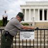 During the partial federal government shutdown in October of 2013, a National Park Service employee posts a sign on a barricade closing access to the Lincoln Memorial in Washington.