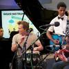 The Bacon Brothers play with students from Washington Heights Expeditionary Learning School (WHEELS), which was one of the New York public schools to receive instruments from the Instrument Drive.