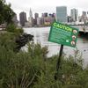 Warning signs at at Combined Sewer Overflow location in Long Island City, Queens.