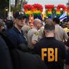FBI agents keep watch during the 2016 Gay Pride Parade in West Hollywood, California on June 12, 2016