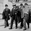 Detective Sergeant Joseph Petrosino, left, escorts Tomasso Petto, second from left, after his 1903 arrest in the Barrel Murder. Two of the city's top detectives--Arthur A. Carey and James McCafferty.