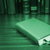 Closed book with green overlay