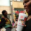 Lori Middleton drinks a large soda on October 17, 2013. A lower court ruling blocked Mayor Michael Bloomberg's campaign to stop fast food restaurants from selling super-sized, sugary drinks.