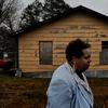 Linda Fay Engle-Harris walks a block from her home where many homes are in bad shape. Tunica County, Mississippi was once one of the poorest counties in America. 