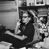 Fleur Fenton Cowles, writer and Associate Editor of Look magazine, sits and talks on the phone behind her office desk in 1955.