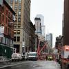 A crane in Lower Manhattan collapsed early Friday morning killing one person and injuring at least two others. Workers were securing the crane when it toppled over, smashing several cars on the block.