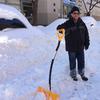 Jairo Pardo spent over an hour shoveling out his car. He plays salsa while he works and says it makes the chore more manageable. 