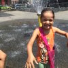 5-year-old Mila said splashing in cold water was the best way to stay cool in 90 degree weather. She was playing with her brother at an East Harlem playground.