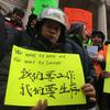 More than a hundred electric bike riding delivery men rallied at City Hall against the NYPD's plans to step up enforcement of electric bike laws in January 2018.
