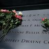 Visitors leave flowers on the names of the six victims of the 1993 World Trade Center bombing on the 25th anniversary of the attacks.