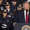Police officers clap in response to President Trump's remarks that police should not to be 'too nice' to suspects they arrest. 