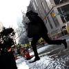 A water main break early on January 15, 2013 leaves a crater in the street at 13th Street and 5th Avenue.