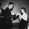 May 1958: Senator John F. Kennedy (1917-1963) helps a coed to click her pen so that he can sign her copy of his book, 'Profiles in Courage,' Portland State College (now Portland State University), Ore