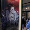 A patron arrives at the Metropolitan Opera on opening night