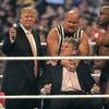 WWE chairman Vince McMahon prepares to have his head shaved by Donald Trump and Bobby Lashley while being held down by ''Stone Cold'' Steve Austin after losing a bet in the Battle of the Billionaires.