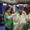 City Harvest volunteers rescuing fresh vegetables from the New York Produce Show to distribute to soup kitchens and food pantries in New York City.  December 4, 2012