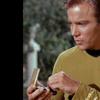 Captain Kirk using a communicator in Star Trek