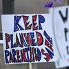 Signs in support of Planned Parenthood at Fillmore Street and Centennial Boulevard on November 29, 2015 in Colorado Springs, Colorado.