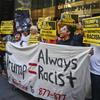 Anti-Trump protesters demonstrate outside a meeting between Donald Trump and minority Republicans at Trump Tower, Thursday Aug. 25, 2016, in New York.