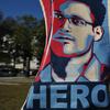 A portrait of Edward Snowden declaring him a 'hero' is seen during a protest against government surveillance on October 26, 2013 in Washington, DC.