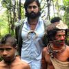 Vikram Gandhi with Munago, a local shaman, and his sons in Hela Province, Papau New Guinea.