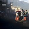 A tap-tap bus carrying commuters makes its way through the street on the second day of a national, general strike in Port-au-Prince, Haiti, early Tuesday, July 10, 2018. 