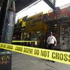 Police investigate a store near the intersection of Bushwick Avenue and Broadway Wednesday, July 13, 2016, in the Brooklyn borough of New York. More than two dozen people were sickened in an apparent 