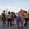 A couple reacts at the end of a song played by the Baby Soda jazz band while swing dancing on Pier 45, Tuesday, June 27, 2017, in New York.