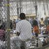  In this June 17, 2018 file photo provided by U.S. Customs and Border Protection, people who've been taken into custody related to cases of illegal entry into the United States, sit in one of the cage