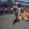 Opposition MDC party supporters protest in the streets of Harare in Zimbabwe during clashes with police Wednesday, Aug. 1, 2018. 