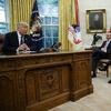 President Donald Trump talks on the phone with Mexican President Enrique Pena Nieto, in the Oval Office of the White House, Monday, Aug. 27, 2018, in Washington. 