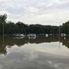 In a Saturday, Aug. 11, 2018 photo, a supermarket parking lot is flooded from rainfall in Little Falls, N.J.