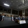 An empty chair reserved for Google's parent Alphabet, which refused to send its top executive, is seen as Facebook COO Sheryl Sandberg accompanied by Twitter CEO Jack Dorsey testify before the Senate 