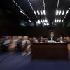 In this photo taken with a slow shutter speed and a zoom, President Donald Trump's Supreme Court nominee, Brett Kavanaugh testifies before the Senate Judiciary Committee on Capitol Hill