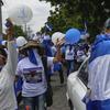 Protestors wave balloons and Nicaraguan flags during an anti-government event coined 'The March of Balloons' in Managua, Nicaragua, Sunday, Sept. 9, 2018.