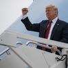 In this Sept. 21, 2018, file photo, President Donald Trump gestures as he arrives at Springfield-Branson National Airport before attending a campaign rally in Springfield, Mo