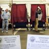 Voters cast their ballots at the fire house in Teaneck, N.J., Tuesday, Nov. 7, 2017.