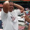 Standing on the floor of Houston's Astrodome, Adrian Munguia, who is deaf, reacts to the news Saturday, Sept. 4, 2005 that a local church has arranged an apartment for her and her family. 