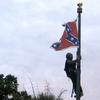 In this June, 27, 2015, file photo, Bree Newsome of Charlotte, N.C., climbs a flagpole to remove the Confederate battle flag at a Confederate monument in front of the Statehouse in Columbia, S.C. 
