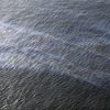 This March 31, 2015, file photo shows an oil sheen drifting from the site of the former Taylor Energy oil rig in the Gulf of Mexico, off the coast of Louisiana. 