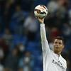 In this Sept. 23, 2014 file photo Real's Cristiano Ronaldo holds the ball as he celebrates his four goals during a Spanish La Liga soccer match between Real Madrid and Elche