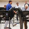 In this Aug. 7, 2018, photo, voters cast their ballots among an array of electronic voting machines in a polling station at the Noor Islamic Cultural Center, Tuesday, Aug. 7, 2018, in Dublin, Ohio. 
