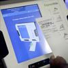 This Oct. 19, 2017, file photo shows a new voting machine which prints a paper record on display at a polling site in Conyers, Ga. 