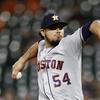 Houston Astros relief pitcher Roberto Osuna throws to the Baltimore Orioles in the ninth inning of a baseball game, Friday, Sept. 28, 2018, in Baltimore.