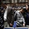 People mourn in Soldiers & Sailors Memorial Hall & Museum during a community gathering held in the aftermath of Saturday's deadly shooting at the Tree of Life Synagogue in Pittsburgh, Sunday, Oct. 28,