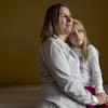 Peggy Young, a former worker for UPS whose health care ended when the company denied her request for special accommodations during her pregnancy, is seen with her daughter Triniti Young, 7, in Washing