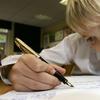 Ten-year-old Cailean Gall from Stewarts Melville Junior School in Edinburgh, Scotland uses his fountain pen in class Nov.16, 2006.